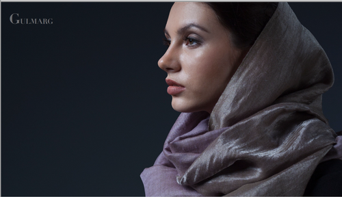 Wear the beauty of one of the highest ski slopes in the world, with this silvery mauve zari-woven pashmina stole. Handwoven from the underbelly fleece of wool-bearing goats traditionally reared in the Himayalan reaches, Pashmina is the original name for Cashmere, which is an anglicised reference to Kashmir, the state in India where they were traditionally woven. Pashmina is different from the shahtoosh shawls, which are now illegal because of the devastating effect that they had on the population of chiru antelopes in the Himalayas. The reason that you rarely, if ever, get a handwoven pashmina in the ritzier and big-brand stores, is because they have large supply lines to cater to, which cannot be fulfilled without resorting to machine looms. Machine looms typically produce a looser weave because the warp has to be strung at a lower tension to avoid breakages (which are a part and parcel of any handwoven textile, particularly one using a fine yarn.) Kajri only sources handwoven pashminas from the state of Kashmir in India and proudly supports local artisans there. As with all our finer handwoven products, we ask that our customers be patient if an item is out of stock. It takes time to weave and ship something as precious as this.